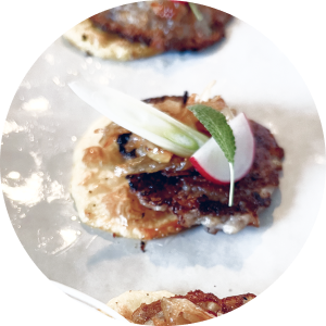 round image of a bite of fish mince on a plate