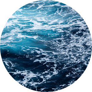 round image of ocean waves in blue